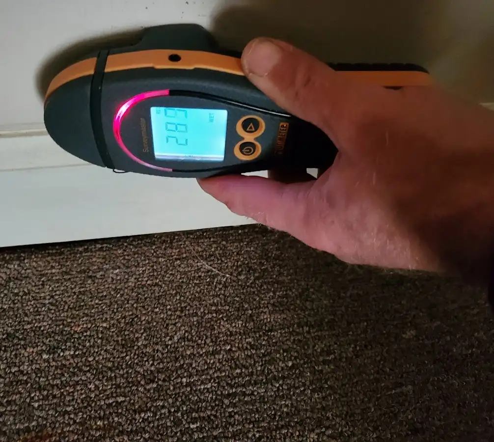 Moisture detection at baseboard during Burst Pipe Cleanup in Highland City